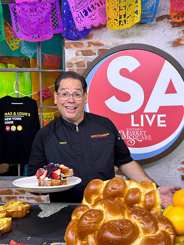 Drew Glick holding summer French toast on SA Live